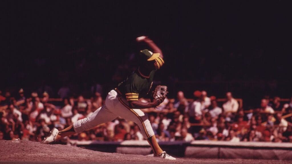 AN OAKLAND A'S PITCHER DELIVERS DURING A GAME WITH THE HOME TEAM CHICAGO CUBS AT WRIGLEY FIELD