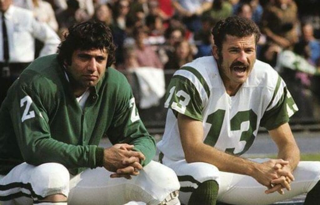 New York Jets QB Joe Namath and WR Don Maynard watch from the bench during a game against the Baltimore Colts on September 24, 1972 at Memorial Stadium in Baltimore