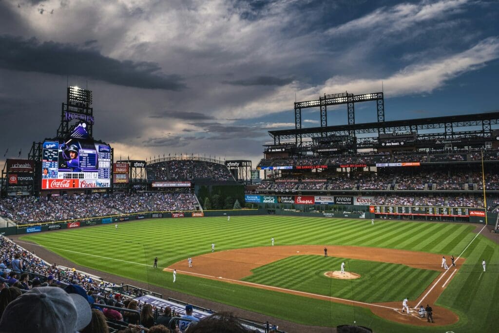people in sports stadium watching baseball game, Coors Field