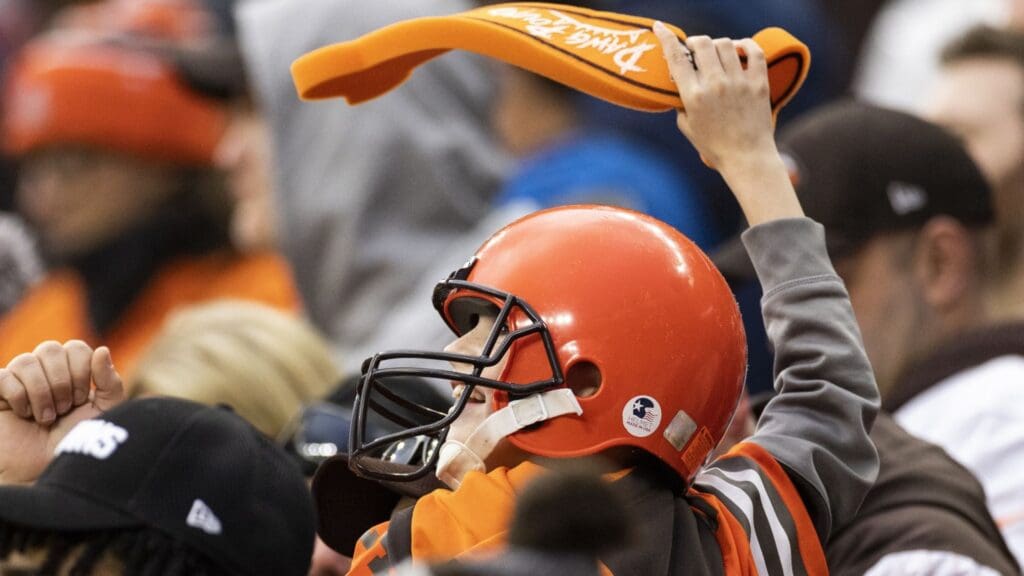 Nov 27, 2022; Cleveland, Ohio, USA; A young Cleveland Browns fan cheers during overtime against the Tampa Bay Buccaneers at FirstEnergy Stadium