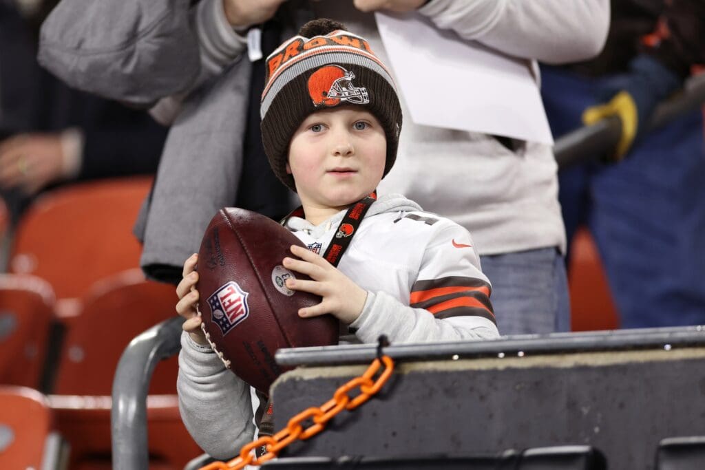 Dec 28, 2023; Cleveland, Ohio, USA; A young Cleveland Browns fan holds a football before the game against the New York Jets at Cleveland Browns Stadium