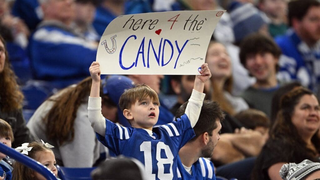 A young Indianapolis Colts fan holds up a sign declaring his intentions during the game against the Jacksonville Jaguars at Lucas Oil Stadium.