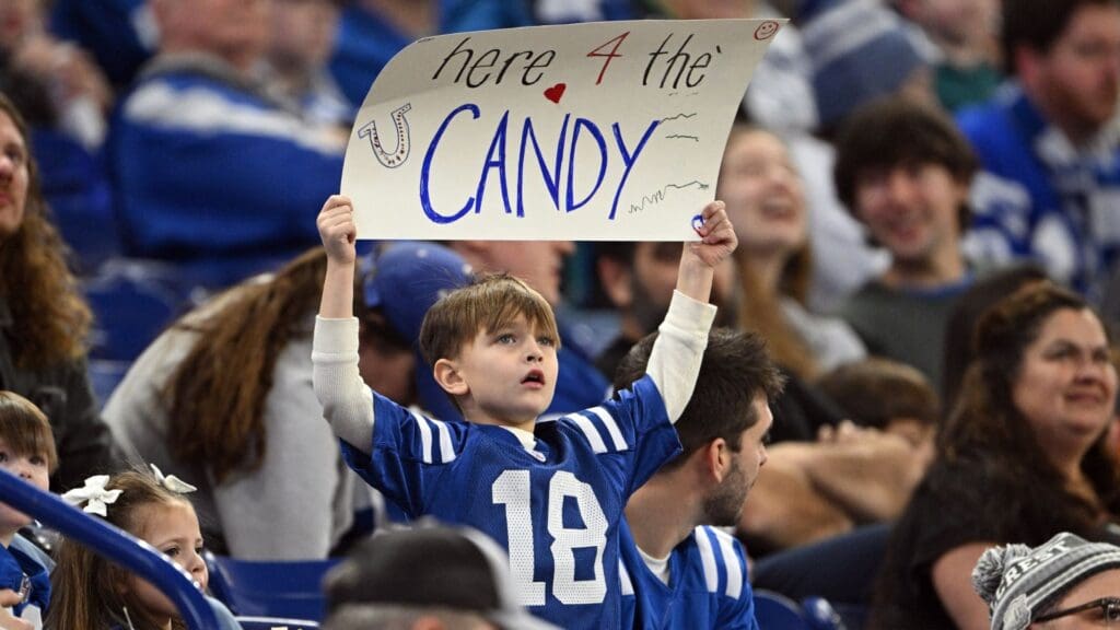 Jan 5, 2025; Indianapolis, Indiana, USA; A young Indianapolis Colts fan holds up a sign declaring his intentions during the game against the Jacksonville Jaguars at Lucas Oil Stadium