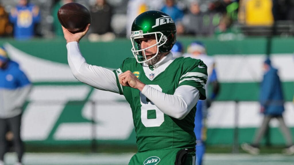 Dec 22, 2024; East Rutherford, New Jersey, USA; New York Jets quarterback Aaron Rodgers (8) warms up before the game against the Los Angeles Rams at MetLife Stadium.