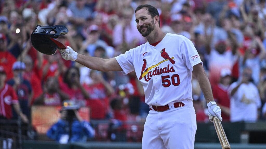 Oct 1, 2023; St. Louis, Missouri, USA; St. Louis Cardinals pinch hitter Adam Wainwright (50) tips his cap as he receives a standing ovation before his final at bat during the eighth inning against the Cincinnati Reds at Busch Stadium.