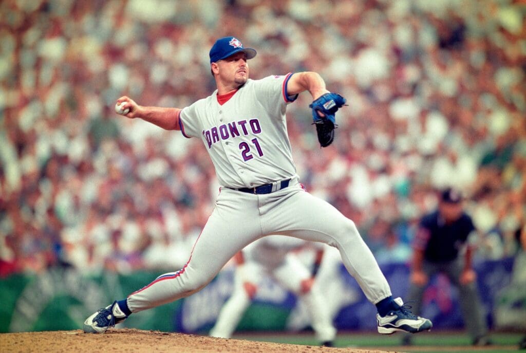 American League pitcher Roger Clemens (21) of the Toronto Blue Jays pitching against the National League during the 1998 MLB All-Star Game at Coors Field.