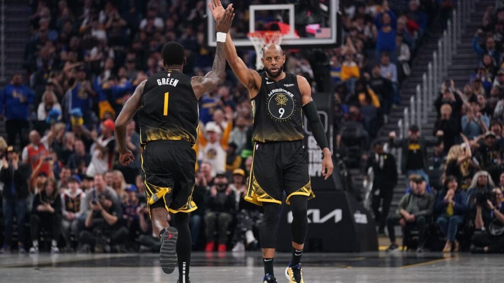 Mar 13, 2023; San Francisco, California, USA; Golden State Warriors guard Andre Iguodala (9) congratulates forward JaMychal Green (1) after Green dunked the ball against the Phoenix Suns in the first quarter at the Chase Center.