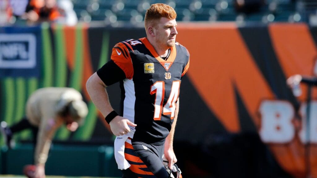 Cincinnati Bengals quarterback Andy Dalton (14) runs off after drills during warmups before the NFL Week 10 game between the Cincinnati Bengals and the Baltimore Ravens at Paul Brown Stadium in downtown Cincinnati on Sunday, Nov. 10, 2019. Baltimore Ravens At Cincinnati Bengals