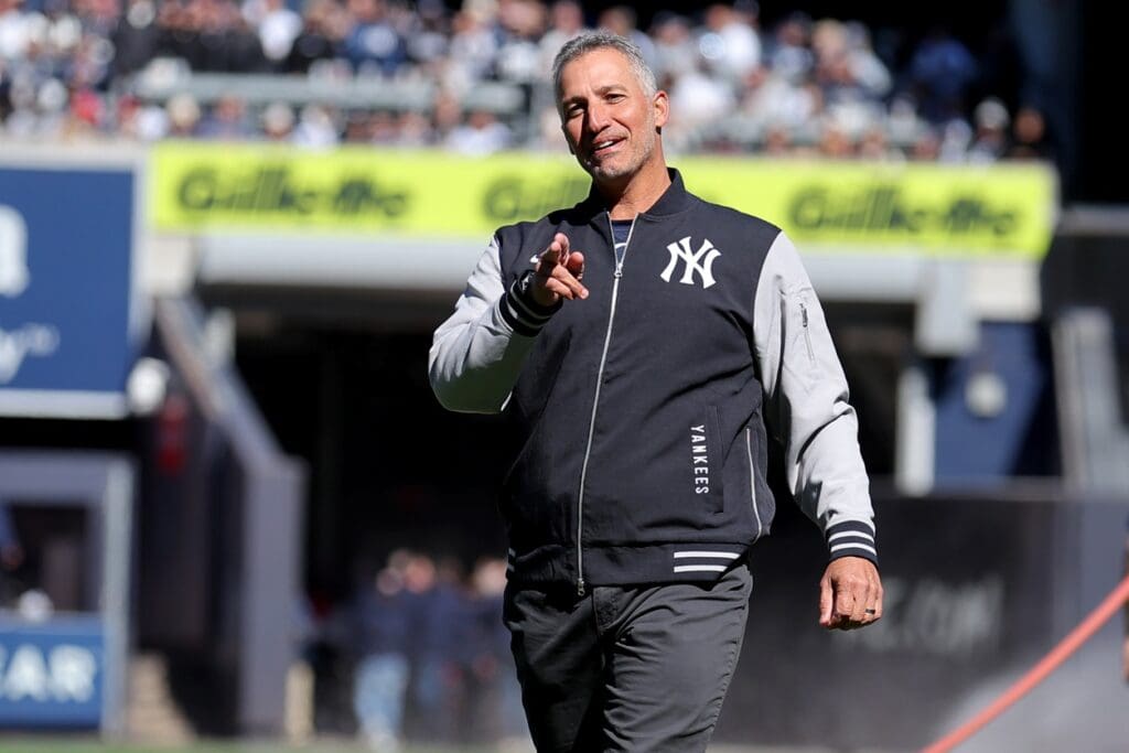 Mar 27, 2025; Bronx, New York, USA; New York Yankees former pitcher Andy Pettitte reacts after throwing out the ceremonial first pitch before an opening day game against the Milwaukee Brewers at Yankee Stadium. Mandatory Credit: Brad Penner-Imagn Images