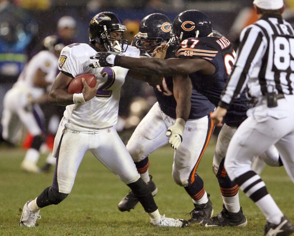 Oct. 23, 2005; Chicago, IL, USA; Chicago Bears defenders Michael Haynes (97) and Alfonso Boone(70) sack Baltimore Ravens quarterback Anthony Wright (2) in the fourth quarter of the Bears' 10-6 win over the Ravens Sunday Oct. 23 at Soldier Field.