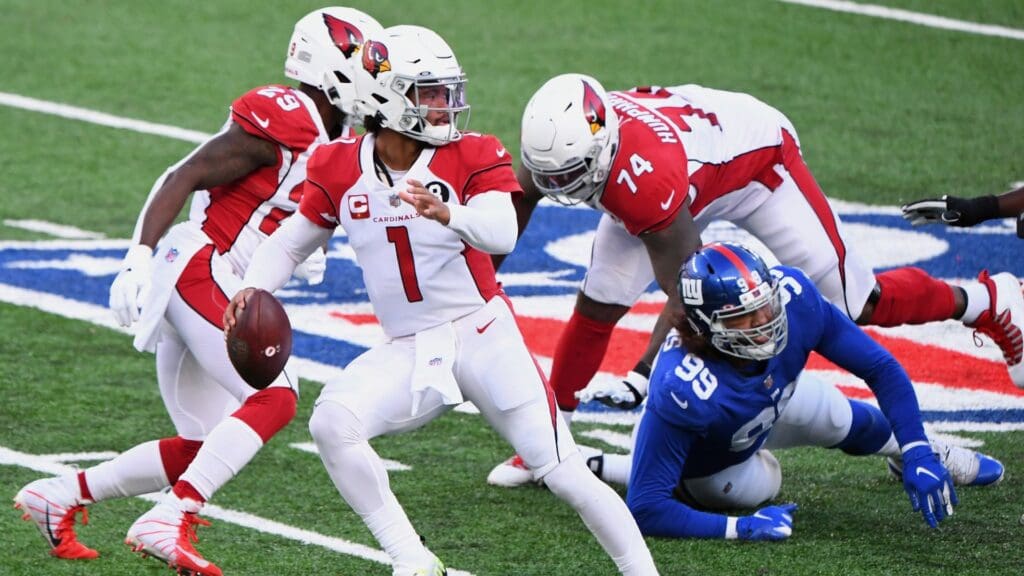 Dec 13, 2020; East Rutherford, New Jersey, USA; Arizona Cardinals quarterback Kyler Murray (1) scrambles away from New York Giants defensive end Leonard Williams (99) during the first half at MetLife Stadium