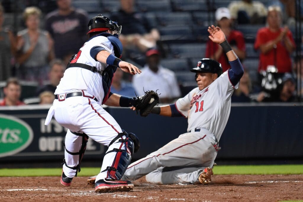 Aug 16, 2016; Atlanta, GA, USA; Atlanta Braves catcher A.J. Pierzynski (15) tags out Minnesota Twins shortstop Jorge Polanco (11) at home plate during the ninth inning at Turner Field. The Twins defeated the Braves 4-2.
