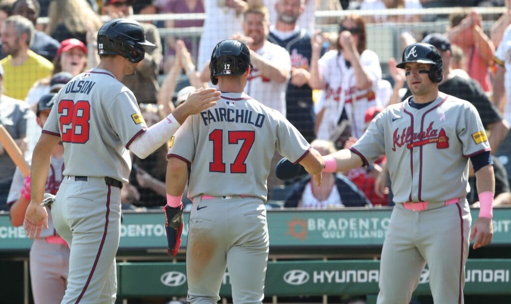 May 11, 2025; Pittsburgh, Pennsylvania, USA; Atlanta Braves first baseman Matt Olson (28) and pinch runner Stuart Fairchild (17) and third baseman Austin Riley (right) celebrate after all three players scored runs against the Pittsburgh Pirates during the eighth inning at PNC Park.