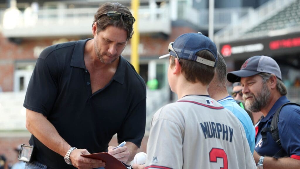 Jun 9, 2017; Atlanta, GA, USA; Atlanta Braves former relief pitcher John Rocker signs autographs for fans before the Braves game against the New York Mets at SunTrust Park.