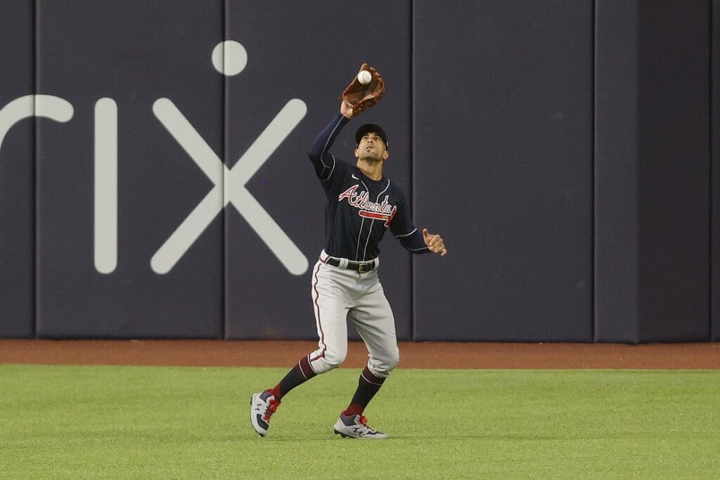 Oct 17, 2020; Arlington, Texas, USA; Atlanta Braves left fielder Nick Markakis (22) catches a fly ball hit by Los Angeles Dodgers second baseman Enrique Hernandez (not pictured) in the eighth inning during game six of the 2020 NLCS at Globe Life Field.