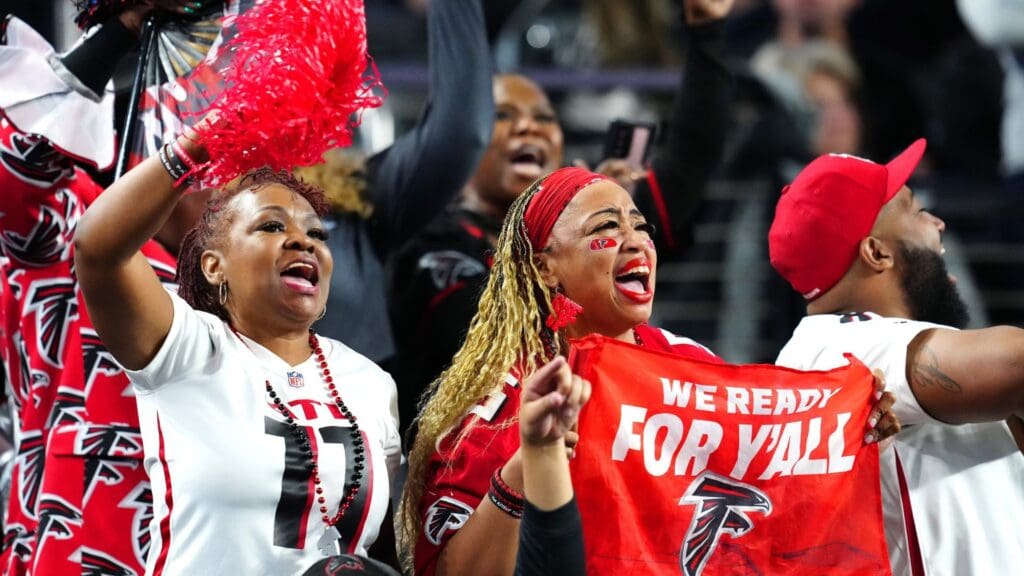 Atlanta Falcons fans cheer during a play between the Falcons and the Las Vegas Raiders during the second quarter at Allegiant Stadium.