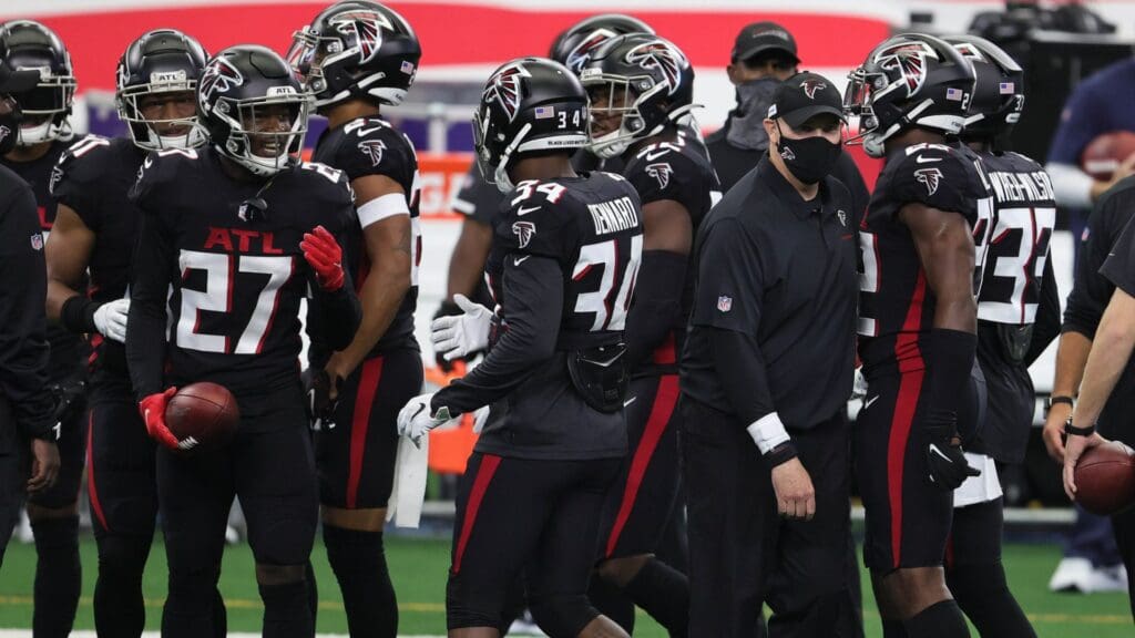 Sep 20, 2020; Arlington, Texas, USA; Atlanta Falcons head coach Dan Quinn with his team prior to the game against the Dallas Cowboys at AT&T Stadium