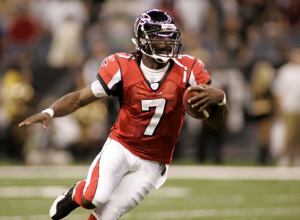 Sep 25, 2006; New Orleans, LA, USA; Atlanta Falcons quarterback (7) Michael Vick scrambles during the 2nd quarter against the New Orleans Saints at the Louisiana Superdome in New Orleans. The Monday Night Football game was the first event in the Louisiana Superdome a year after it was heavily damaged by Hurricane Katrina and used as a shelter from the storm by tens of thousands of people.