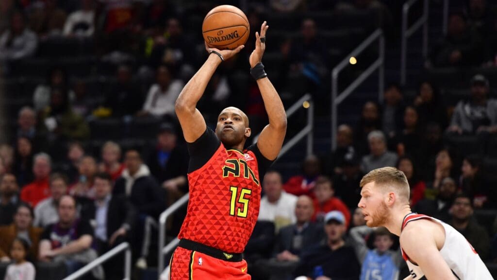 Mar 6, 2020; Washington, District of Columbia, USA; Atlanta Hawks guard Vince Carter (15) shoots against Washington Wizards forward Davis Bertans (42) during the first half at Capital One Arena