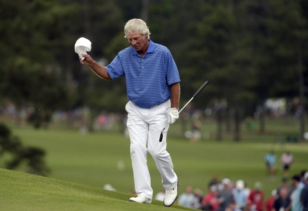 Apr 10, 2015; Augusta, GA, USA; Ben Crenshaw waves to the crowd as he walks to the 18th green during the second round of The Masters golf tournament at Augusta National Golf Club.