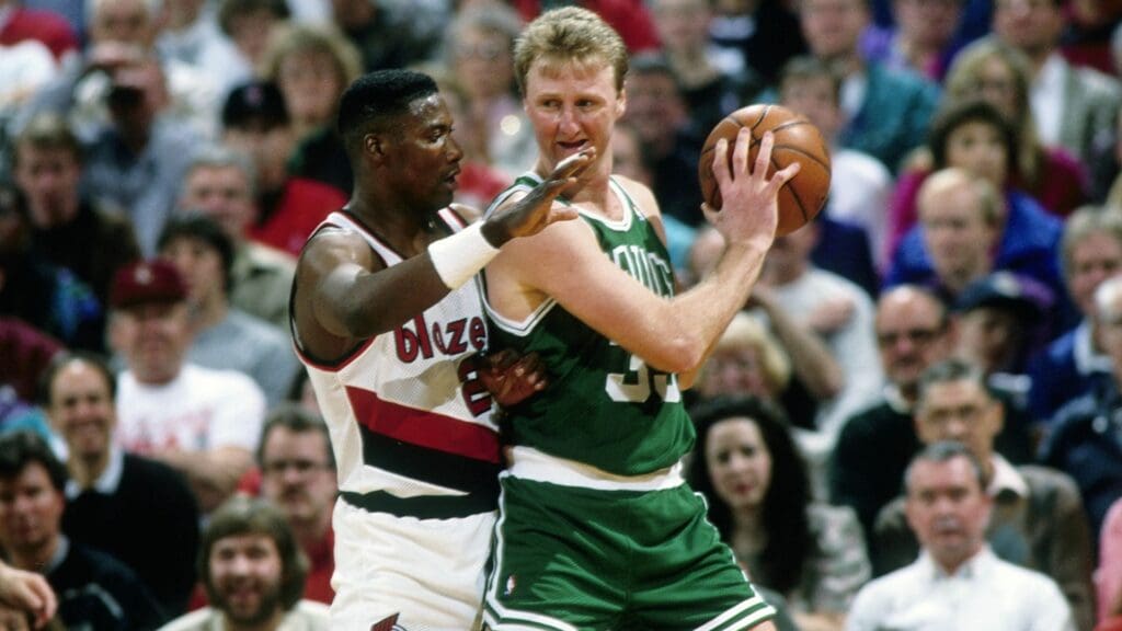Mar 10, 1991; Portland, OR, USA: FILE PHOTO; Boston Celtics forward Larry Bird (33) is defended by Portland Trail Blazers forward Jerome Kersey (25) at Memorial Coliseum.