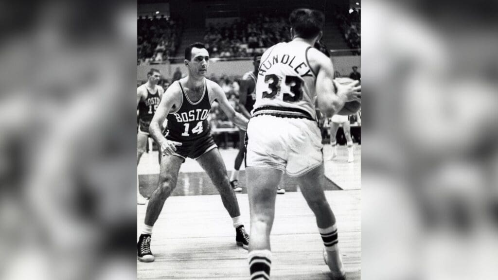 Feb 22, 1961; Los Angeles, CA, USA; FILE PHOTO; Boston Celtics guard Bob Cousy (14) defends Los Angeles Lakers guard Rod Hundley (33) at the Forum