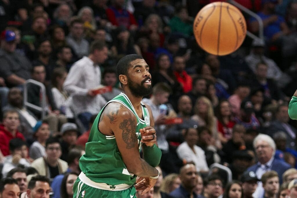 Feb 23, 2018; Detroit, MI, USA; Boston Celtics guard Kyrie Irving (11) passes in the second half against the Detroit Pistons at Little Caesars Arena.