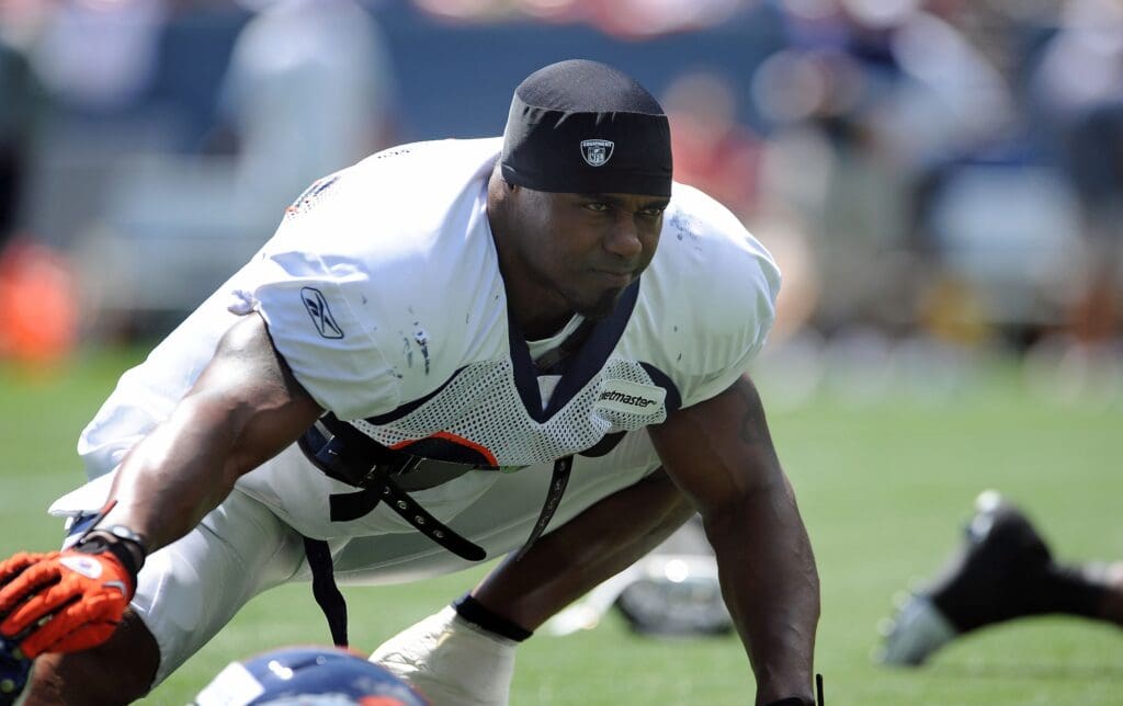 August 6, 2011; Denver, CO, USA; Denver Broncos safety Brian Dawkins (20) warms up before the start of a training camp session at Invesco Field.
