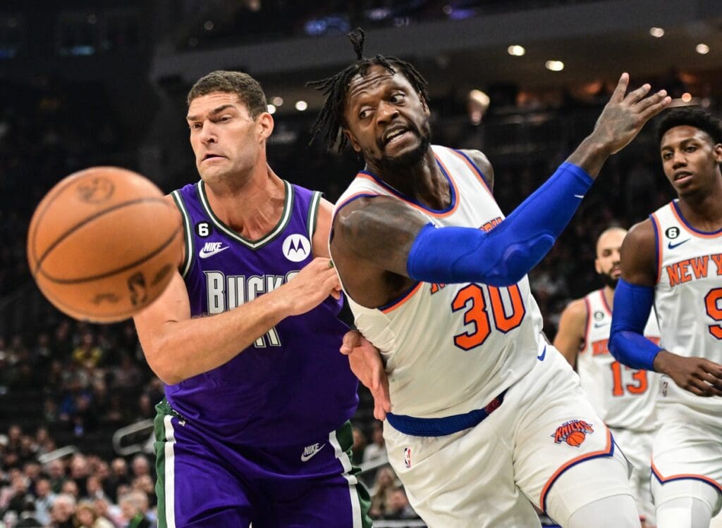 Oct 28, 2022; Milwaukee, Wisconsin, USA; New York Knicks forward Julius Randle (30) and Milwaukee Bucks center Brook Lopez (11) play for the ball in the first quarter at Fiserv Forum. Mandatory Credit: Benny Sieu-USA TODAY Sports