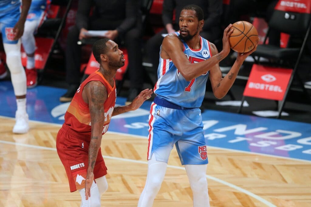 Jan 12, 2021; Brooklyn, New York, USA; Brooklyn Nets power forward Kevin Durant (7) controls the ball against Denver Nuggets small forward Will Barton (5) during the first quarter at Barclays Center.