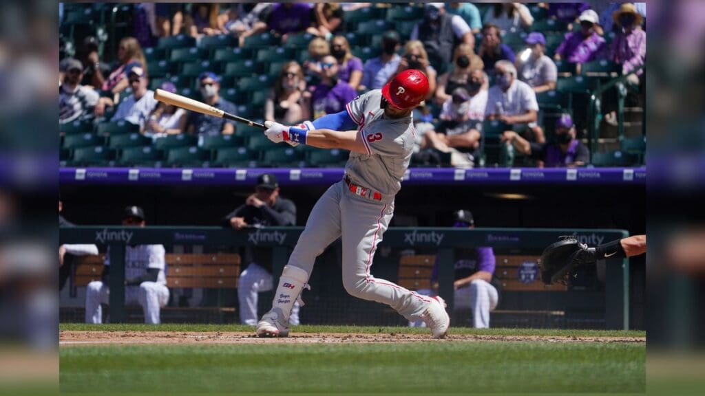 Apr 25, 2021; Denver, Colorado, USA; Philadelphia Phillies right fielder Bryce Harper (3) hits his second solo home run of the game during the third inning against the Colorado Rockies at Coors Field.