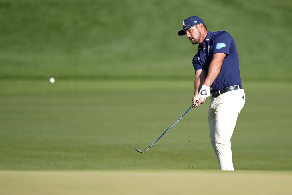 May 18, 2025; Charlotte, North Carolina, USA; Bryson DeChambeau takes a shot on the 18th hole during the final round of the PGA Championship golf tournament at Quail Hollow.