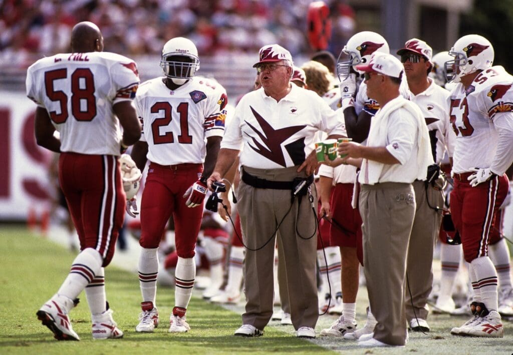 Oct 23, 1994; Tempe, AZ, USA; FILE PHOTO; Arizona Cardinals head coach Buddy Ryan on the sidelines with Eric Hill (58) and James Williams (21) against the Dallas Cowboys at Sun Devil Stadium.