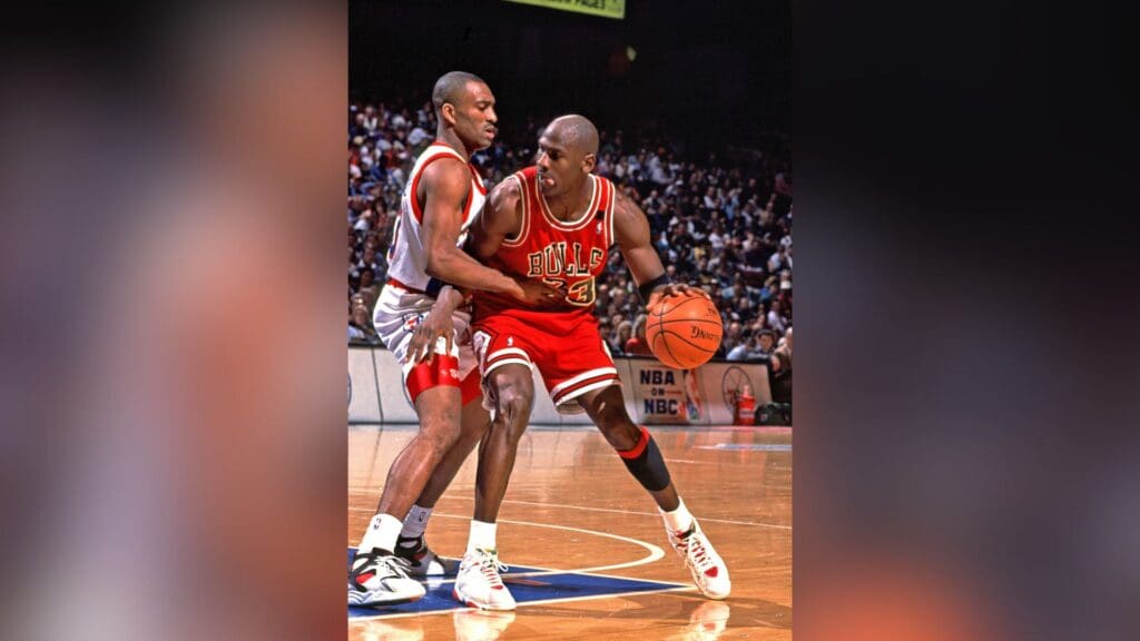 Chicago Bulls guard (23) Michael Jordan in action against Philadelphia 76ers guard (33) Hersey Hawkins at the Spectrum.
