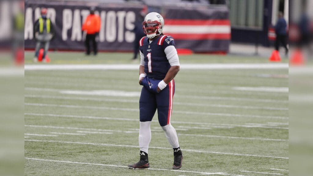 Jan 3, 2021; Foxborough, Massachusetts, USA; New England Patriots quarterback Cam Newton (1) smiles after a touchdown against the New York Jets during the first half at Gillette Stadium.