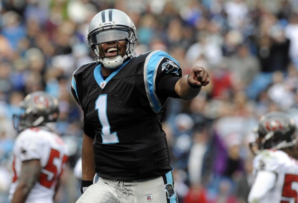 December 24, 2011; Charlotte, NC, USA; Carolina Panthers quarterback Cam Newton (1) celebrates after scoring a touchdown during the game against the Tampa Bay Buccaneers at Bank of America Stadium. Carolina Panthers win 48-16.