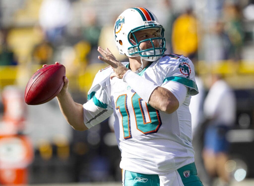 Sep 21, 2010; Green Bay, WI, USA; Miami Dolphins quarterback Chad Pennington (10) throws a pass during warmups prior to the game against the Green Bay Packers at Lambeau Field. The Dolphins defeated the Packers 23-20. Mandatory Credit: Jeff Hanisch-USA TODAY Sports