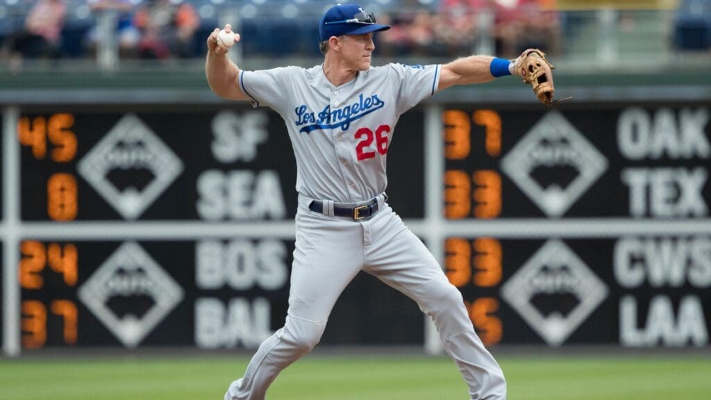 Jul 25, 2018; Philadelphia, PA, USA; Los Angeles Dodgers second baseman Chase Utley (26) throws against the Philadelphia Phillies at Citizens Bank Park. Mandatory Credit: Bill Streicher-Imagn Images