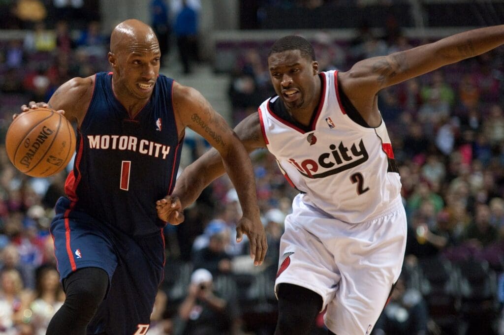 Dec 15, 2013; Auburn Hills, MI, USA; Detroit Pistons shooting guard Chauncey Billups (1) dribbles the ball around Portland Trail Blazers shooting guard Wesley Matthews (2) during the second quarter at the Palace of Auburn Hills. Mandatory Credit: Tim Fuller-USA TODAY Sports