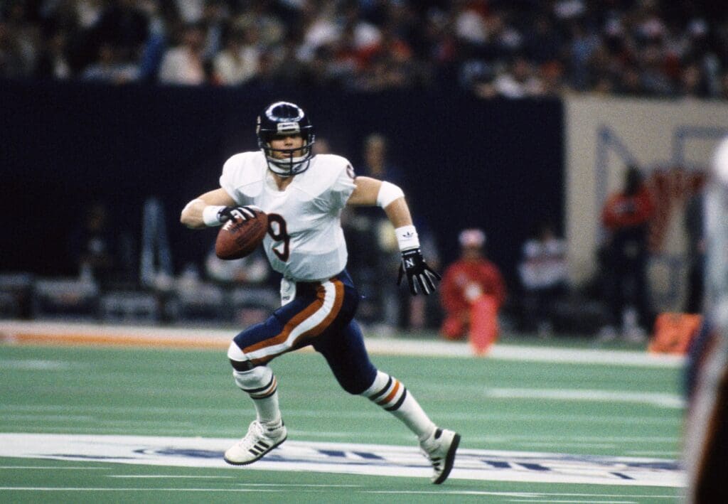 Jan 26, 1986; New Orleans, LA, USA; FILE PHOTO; Chicago Bears quarterback (9) Jim McMahon in action against the New England Patriots during Super Bowl XX at the Superdome. The Bears defeated the Patriots 46-10.