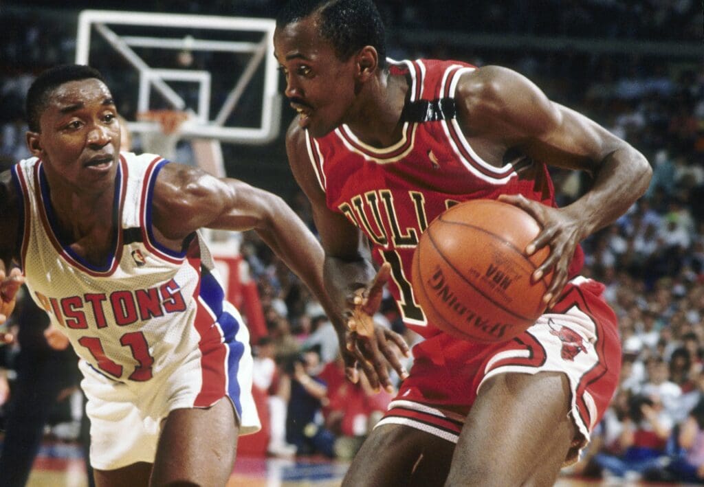Chicago Bulls guard Craig Hodges (14) is defended by Detroit Pistons guard Isiah Thomas (11) during the 1988-89 NBA Eastern Conference Finals at The Palace. The Pistons defeated the Bulls 4 games to 2.