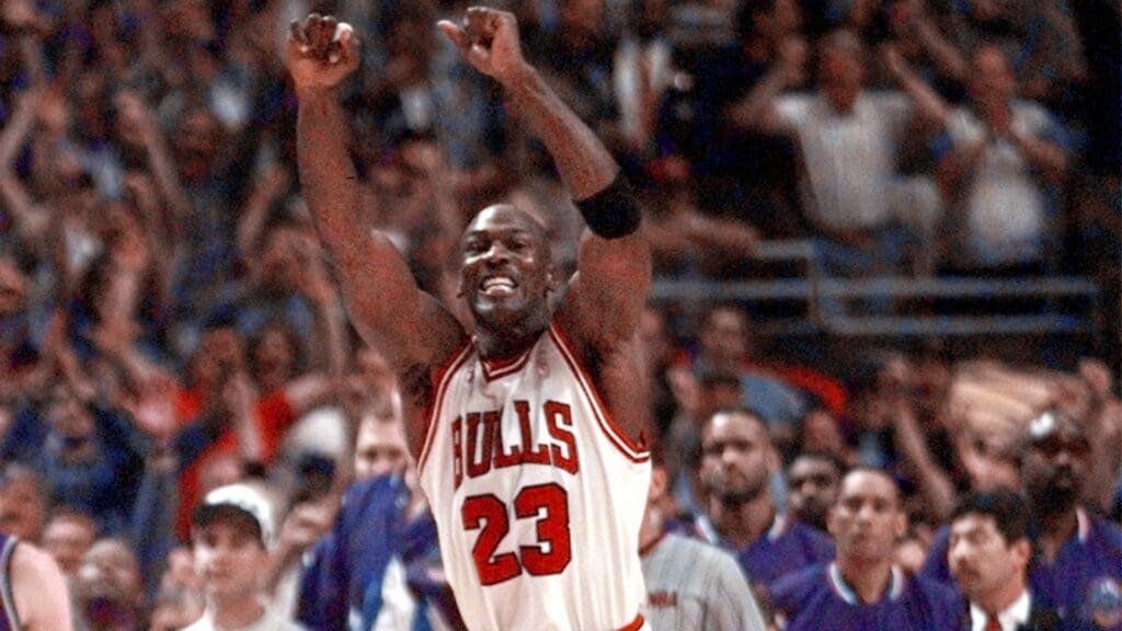 Jun 13, 1997; Chicago, IL, USA; Chicago Bulls guard Michael Jordan celebrates as time expires as they defeat the Utah Jazz in the 1997 NBA Finals at the United Center
