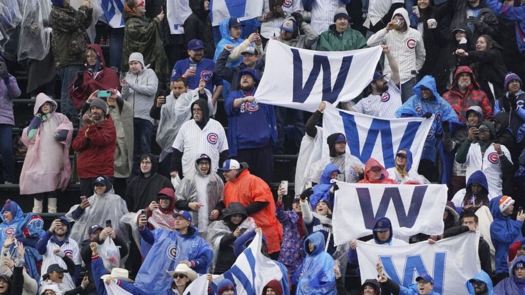 Apr 1, 2024; Chicago, Illinois, USA; Chicago Cubs fans celebrate the Cubs win against the Colorado Rockies at Wrigley Field.