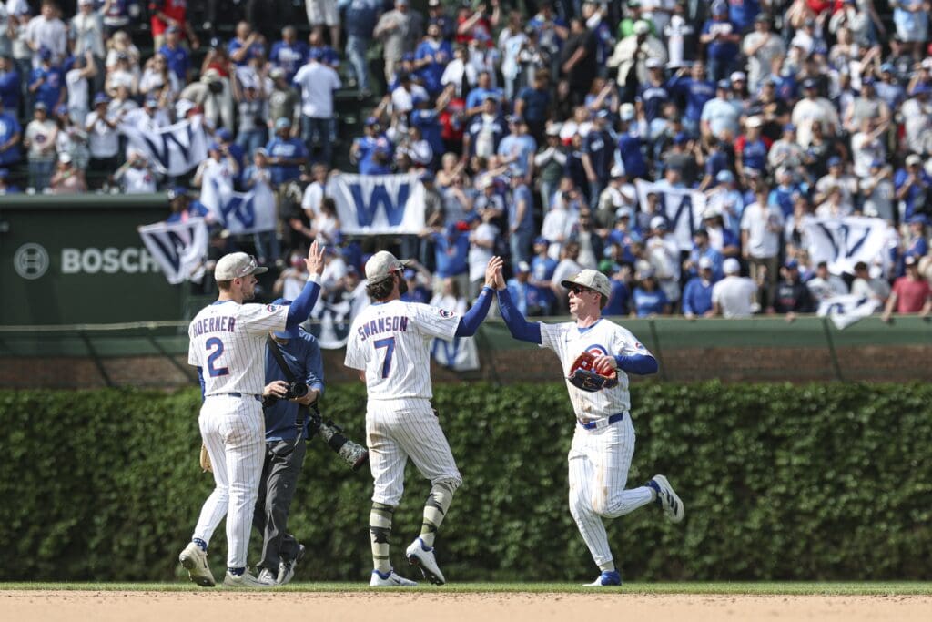 May 17, 2025; Chicago, Illinois, USA; Chicago Cubs players celebrate team's win against the Chicago White Sox in a baseball game at Wrigley Field