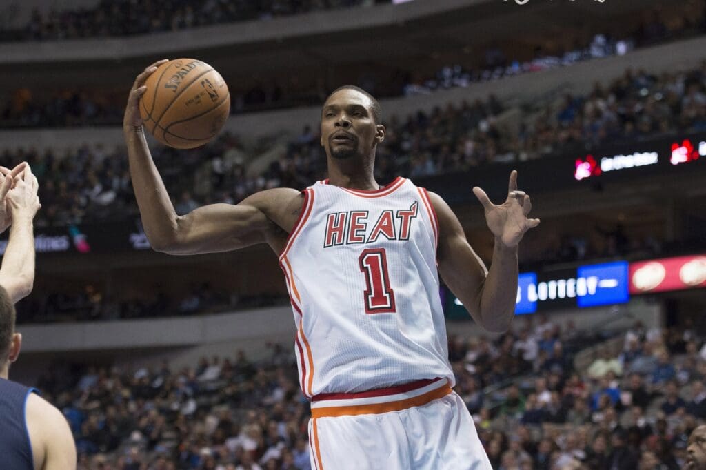 Feb 3, 2016; Dallas, TX, USA; Miami Heat forward Chris Bosh (1) grabs a rebound against the Dallas Mavericks during the first quarter at the American Airlines Center.