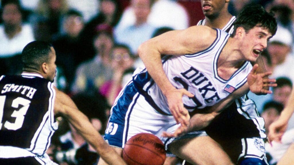 Mar 22, 1991; Pontiac, MI, USA; FILE PHOTO; Connecticut Huskies guard Chris Smith (13) knocks the ball loose from Duke Blue Devils forward Christian Laettner (32) during the 1991 NCAA Tournament at the Silverdome. Duke defeated Connecticut 81-67