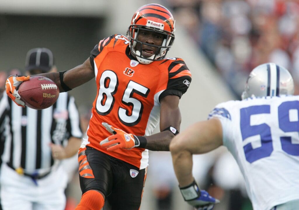Nov 7, 2004; Cincinnati, OH, USA;Cincinnati Bengals #85 Chad Johnson tries to break away from Dallas Cowboys #59 Dat Nguyen at Paul Brown Stadium. Bengals beat the Cowboys 26-3.