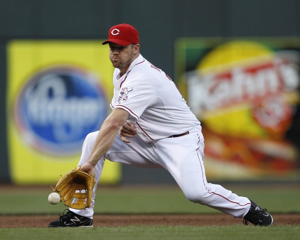 AUGUST 17, 2012: Cincinnati Reds third baseman Scott Rolen (27) makes the grab and the throw to first for the out in the third inning against the Chicago Cubs. Reds
