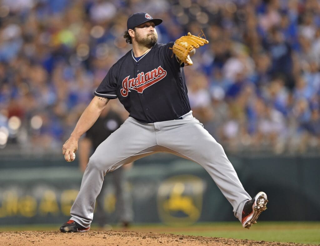 Cleveland Indians pitcher Joba Chamberlain (62) delivers a pitch against the Kansas City Royals during the eighth inning at Kauffman Stadium.