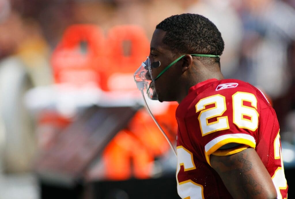 September 19, 2010; Landover, MD, USA; Washington Redskins running back Clinton Portis (26) gets oxygen on the bench prior to the Redskins game against the Houston Texans at FedEx Field. The Texans won 30-27 in overtime.